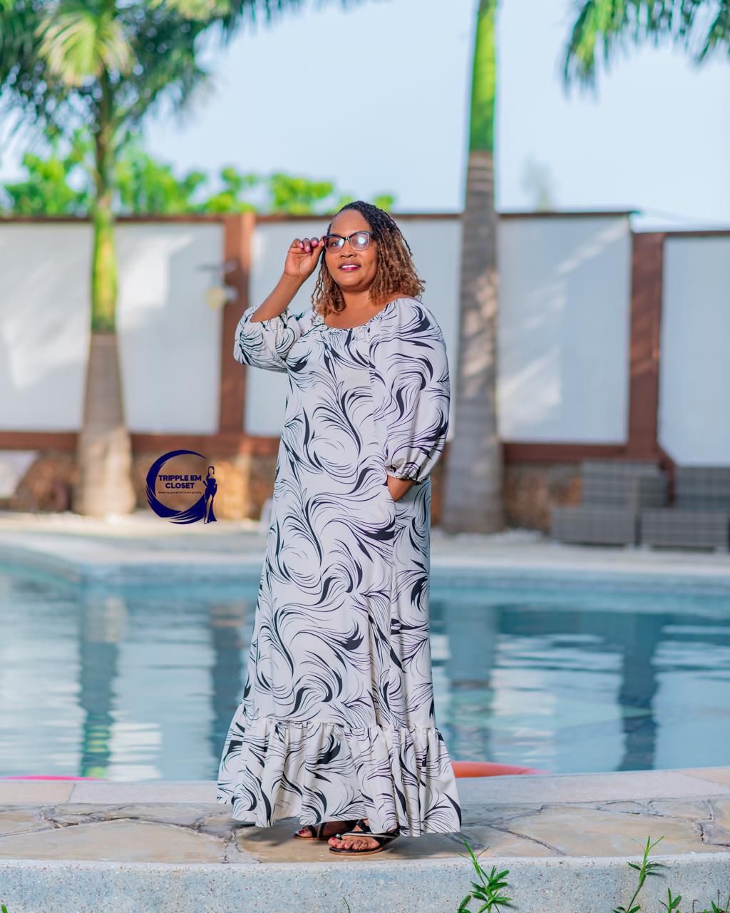 Elegant Off-Shoulder Maxi Dress with Flowing Ruffle Hem & Chic Swirl Print