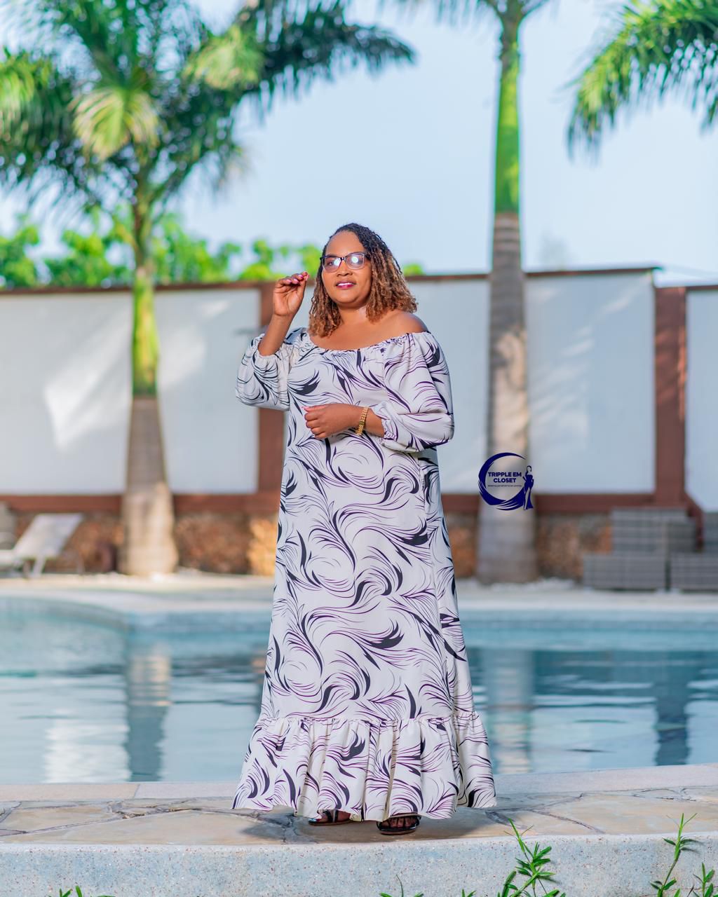 Elegant Off-Shoulder Maxi Dress with Flowing Ruffle Hem & Chic Swirl Print