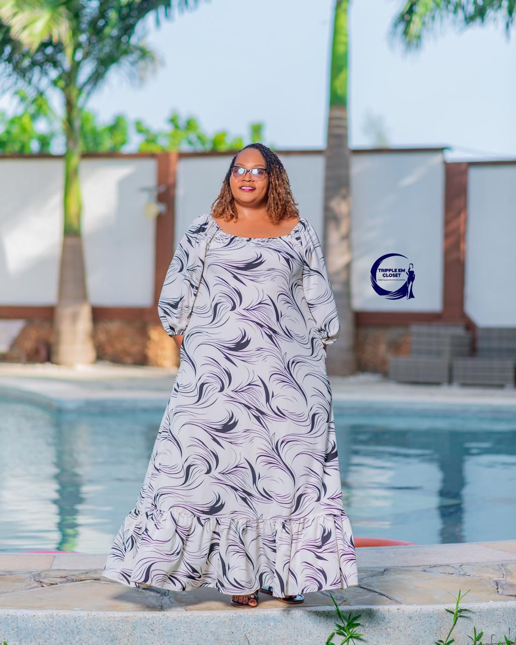Elegant Off-Shoulder Maxi Dress with Flowing Ruffle Hem & Chic Swirl Print